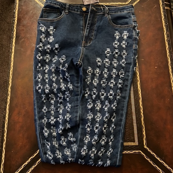 Denim jeans with holes all over - Picture 2 of 3